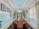 Formal dining room with wood table and chairs, decorative accents, and natural light at 14442 Avenue Of The Rushes, Winter Garden, FL 34787