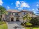Stunning two-story home with stone accents and a welcoming front porch at 14442 Avenue Of The Rushes, Winter Garden, FL 34787