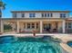 Home exterior showcasing a large covered patio and pool at 14442 Avenue Of The Rushes, Winter Garden, FL 34787