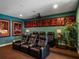 Home theater with reclining seats and projector, ready for movie nights at 14442 Avenue Of The Rushes, Winter Garden, FL 34787