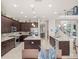 Modern kitchen featuring stainless steel appliances and a large island at 14442 Avenue Of The Rushes, Winter Garden, FL 34787