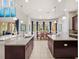 Spacious kitchen with large island, stainless steel appliances, and ample counter space at 14442 Avenue Of The Rushes, Winter Garden, FL 34787