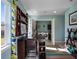 Convenient laundry room with washer, dryer, and built-in shelving at 14442 Avenue Of The Rushes, Winter Garden, FL 34787