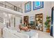 Spacious living room with high ceilings, built-in shelves, and comfortable seating at 14442 Avenue Of The Rushes, Winter Garden, FL 34787