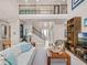 Open living area with high ceilings, a view to the entryway and kitchen at 14442 Avenue Of The Rushes, Winter Garden, FL 34787