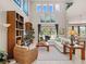 Spacious living room with high ceilings, large windows, and comfortable seating at 14442 Avenue Of The Rushes, Winter Garden, FL 34787