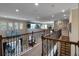 Open upper landing overlooking main living areas with staircase access at 14442 Avenue Of The Rushes, Winter Garden, FL 34787