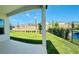 A spacious backyard offers views of a well-maintained lawn and neighboring houses against a clear blue sky at 16337 Silver Grove Blvd, Winter Garden, FL 34787