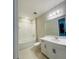 Bright bathroom featuring a bathtub with shower, and a single vanity at 16337 Silver Grove Blvd, Winter Garden, FL 34787
