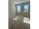 Well-lit bedroom with two windows and carpeted floor at 16337 Silver Grove Blvd, Winter Garden, FL 34787