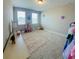 Cozy bedroom with carpeted floor, large windows, and space for creative play at 16337 Silver Grove Blvd, Winter Garden, FL 34787