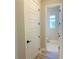 Hallway view into a powder room with modern door at 16337 Silver Grove Blvd, Winter Garden, FL 34787