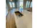 Spacious kitchen island with quartz countertop, stainless steel sink and faucet, perfect for meal prep and entertaining at 16337 Silver Grove Blvd, Winter Garden, FL 34787