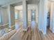 Open-concept living space showcasing wood-look floors and seamless flow between living and dining areas at 16337 Silver Grove Blvd, Winter Garden, FL 34787