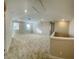Spacious loft area with neutral carpeting and two windows at 16337 Silver Grove Blvd, Winter Garden, FL 34787