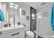 Bright, modern bathroom with a glass-enclosed shower, sleek vanity, and stylish fixtures, offering a spa-like experience at 1901 Lake Sue Dr, Orlando, FL 32803