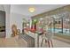 Dining area with glass table and views of the pool at 1901 Lake Sue Dr, Orlando, FL 32803