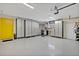 Spacious garage features epoxy floors, built-in cabinets, and ample storage space for vehicles and projects at 1901 Lake Sue Dr, Orlando, FL 32803