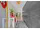 Modern entryway with gray tile accent wall, light wood floors, and contemporary accents at 1901 Lake Sue Dr, Orlando, FL 32803