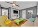 Open living room boasts hardwood floors, recessed lighting, and entertainment center, great for relaxing and entertaining at 1901 Lake Sue Dr, Orlando, FL 32803