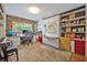 Versatile home office with built-in shelving, work space, murphy bed, and ample natural light at 1901 Lake Sue Dr, Orlando, FL 32803