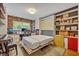 Office with a murphy bed featuring built-in shelves and desk space, bathed in natural light at 1901 Lake Sue Dr, Orlando, FL 32803