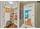 Organized pantry space with shelving offering great storage solutions, complemented by a hallway leading to an inviting bedroom at 1901 Lake Sue Dr, Orlando, FL 32803