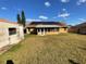 Backyard with detached shed and solar panels at 1938 Gamboge Dr, Orlando, FL 32822