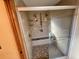 Large walk-in shower with tiled walls and a built-in seat at 1938 Gamboge Dr, Orlando, FL 32822