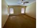 Spacious bedroom with hardwood floors and ceiling fan at 1938 Gamboge Dr, Orlando, FL 32822