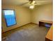 Bright bedroom with carpeted floor and built-in desk at 1938 Gamboge Dr, Orlando, FL 32822