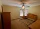 Spacious bedroom with wood furniture and window coverings at 1938 Gamboge Dr, Orlando, FL 32822