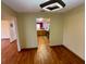 Dining room with hardwood floors and view of kitchen at 1938 Gamboge Dr, Orlando, FL 32822