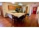 Eat-in kitchen with stainless steel appliances and an island at 1938 Gamboge Dr, Orlando, FL 32822