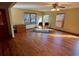 Spacious living room featuring hardwood floors and lots of natural light at 1938 Gamboge Dr, Orlando, FL 32822