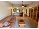Living room with hardwood floors and view of kitchen at 1938 Gamboge Dr, Orlando, FL 32822