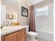 Clean bathroom with a shower/tub combo and wood vanity at 2119 Victoria Dr, Davenport, FL 33837