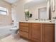 Updated bathroom with a single sink vanity and bathtub at 2119 Victoria Dr, Davenport, FL 33837