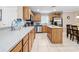 Spacious kitchen with light wood cabinets, stainless steel appliances, and an island at 2119 Victoria Dr, Davenport, FL 33837