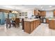 Kitchen with light wood cabinets, stainless steel appliances, and an island at 2119 Victoria Dr, Davenport, FL 33837