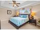 Main bedroom with a king-size bed and ceiling fan at 2119 Victoria Dr, Davenport, FL 33837