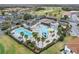 Community pool area with tennis courts and playground at 2119 Victoria Dr, Davenport, FL 33837