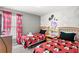Mickey Mouse themed bedroom with twin beds, nightstand, and themed bedding at 2220 Wyndham Palms Way, Kissimmee, FL 34747
