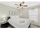 Bedroom with a queen-size bed and ceiling fan at 2220 Wyndham Palms Way, Kissimmee, FL 34747