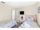 Bedroom with two twin beds, featuring Disney Princess bedding and decor at 2220 Wyndham Palms Way, Kissimmee, FL 34747