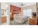 Bedroom with king-size bed, dresser, and ensuite bathroom at 2220 Wyndham Palms Way, Kissimmee, FL 34747