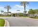 Community clubhouse with palm trees and landscaping at 2220 Wyndham Palms Way, Kissimmee, FL 34747