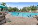 Large community pool with plenty of lounge chairs at 2220 Wyndham Palms Way, Kissimmee, FL 34747