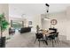 Dining area with a modern wood table and black chairs at 2220 Wyndham Palms Way, Kissimmee, FL 34747