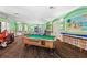 Bright game room with pool table, ping pong, and arcade games at 2220 Wyndham Palms Way, Kissimmee, FL 34747